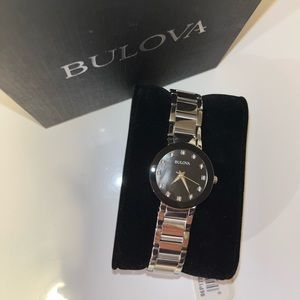 Silver Bulova watch with black face